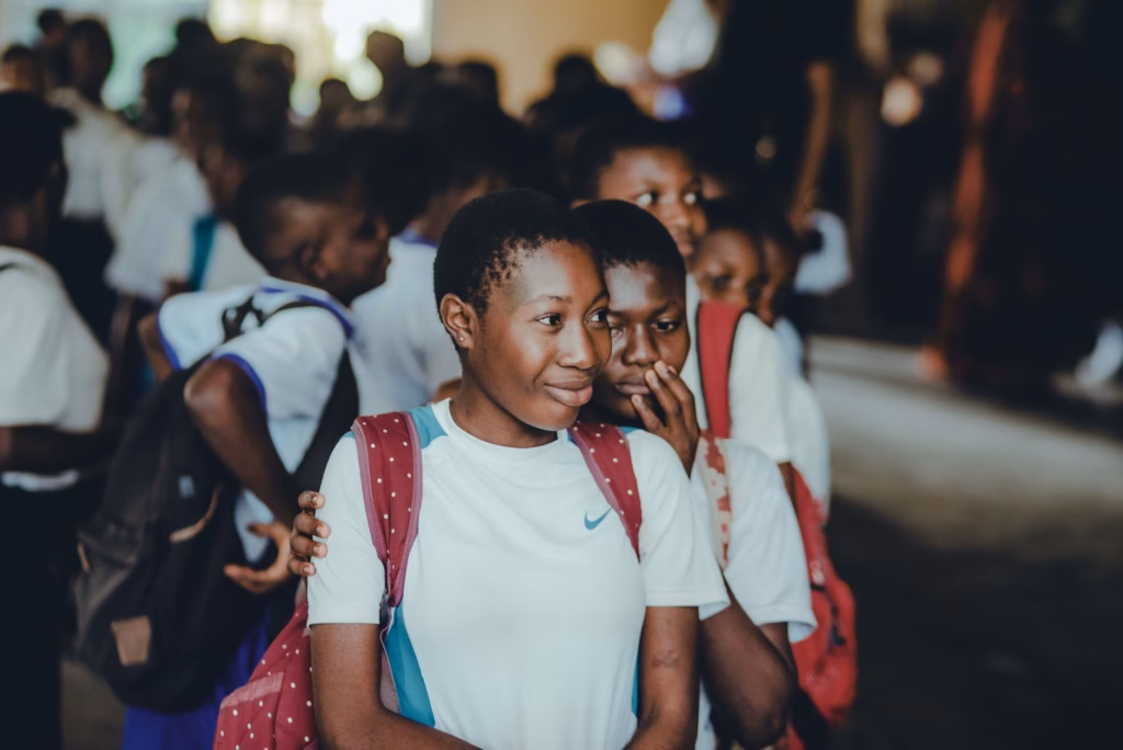 A busy school corridor illustrates settings where adenovirus outbreaks can occur