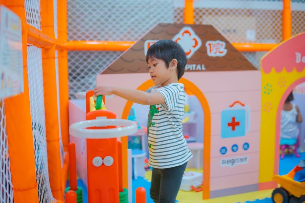 A child playing safely on a soft surface, illustrating injury prevention