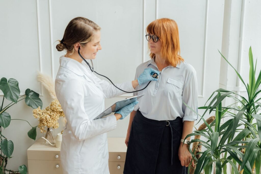 A doctor listening attentively to a patient describing their symptoms