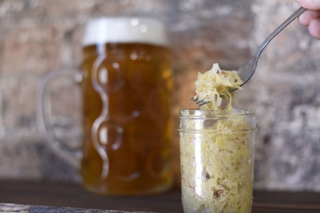 A glass jar of raw sauerkraut, a source of live lactobacilli