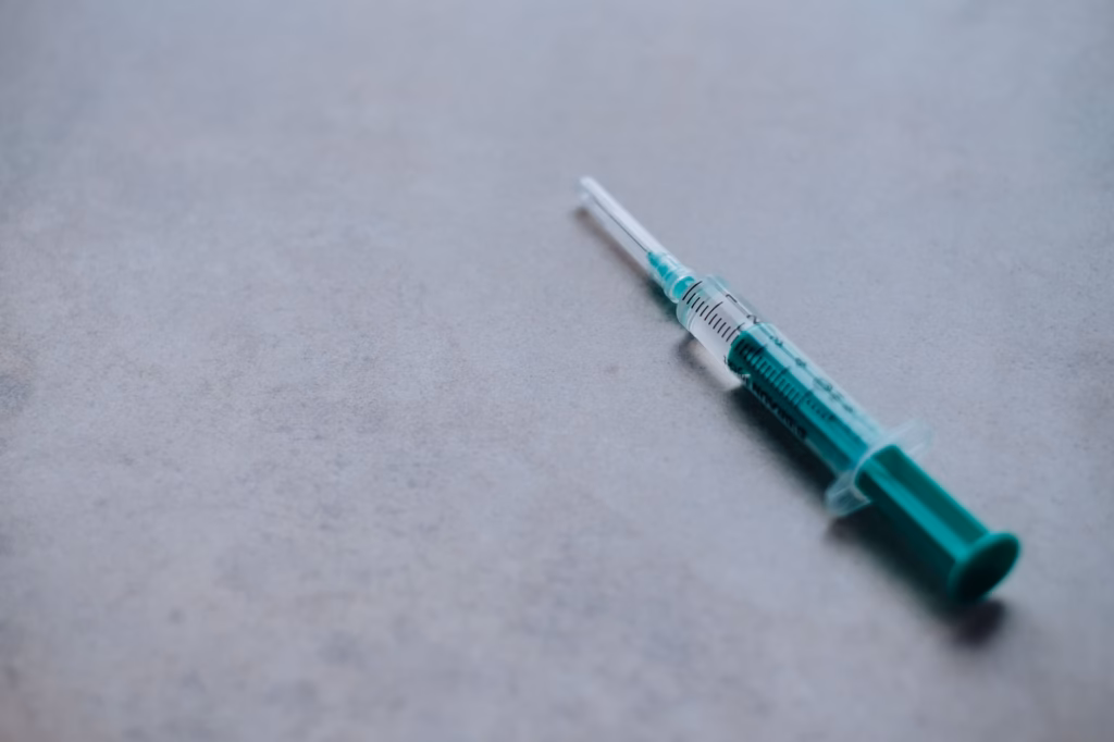 A healthcare worker administering a flu shot, emphasizing vaccination