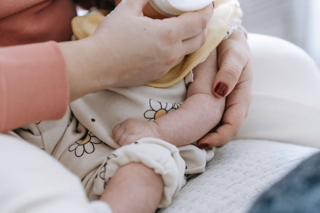 A newborn nursing, illustrating on‑demand feeding during a growth spurt