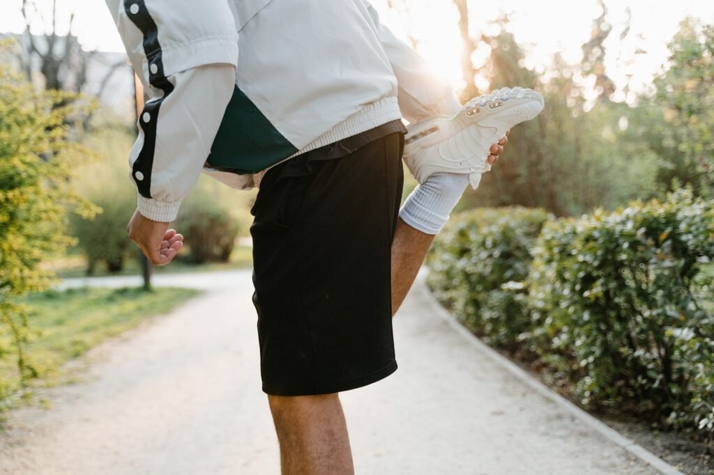 A person gently stretches a cramped calf muscle