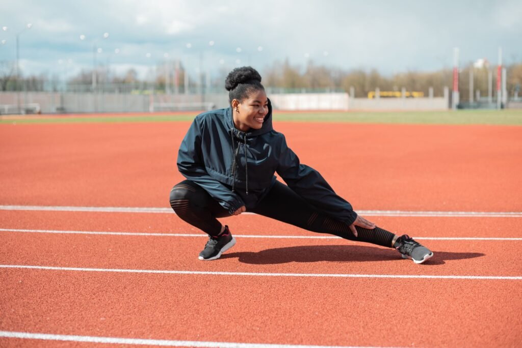 A person gently stretching the hip joint to improve flexibility