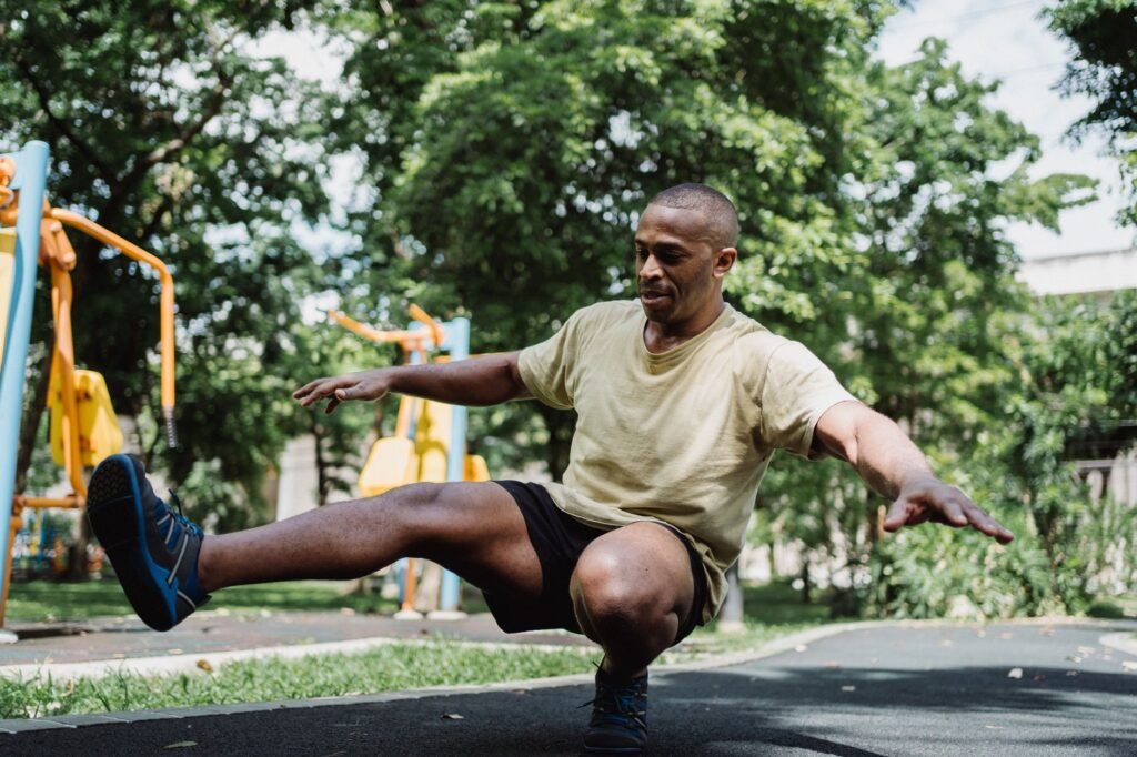 A person performing a balanced warm‑up routine to prevent strains