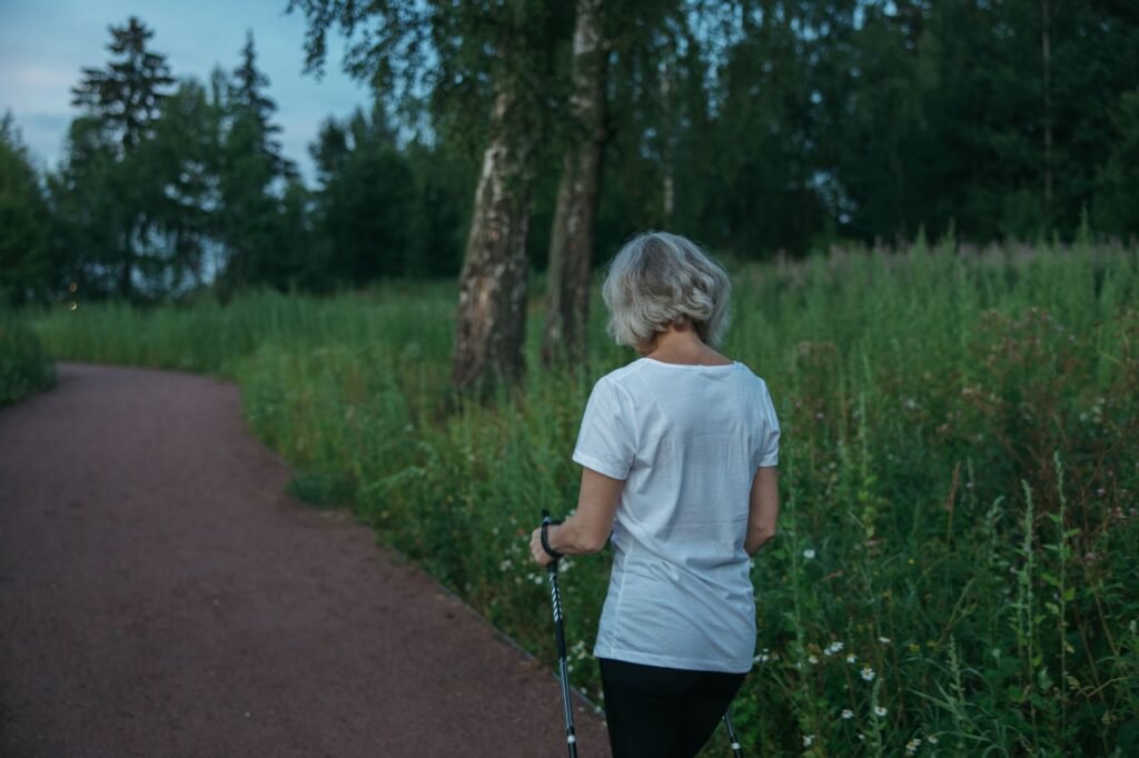 An older adult walking confidently, illustrating active living for hip health