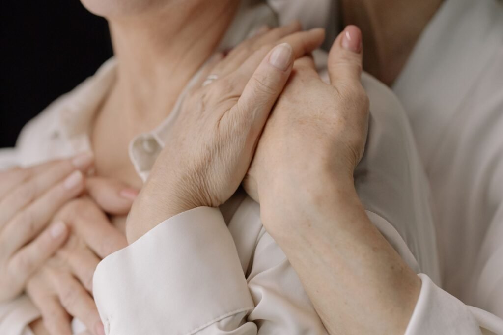 Close‑up of aged hands showing limited movement, illustrating joint stiffness in daily life